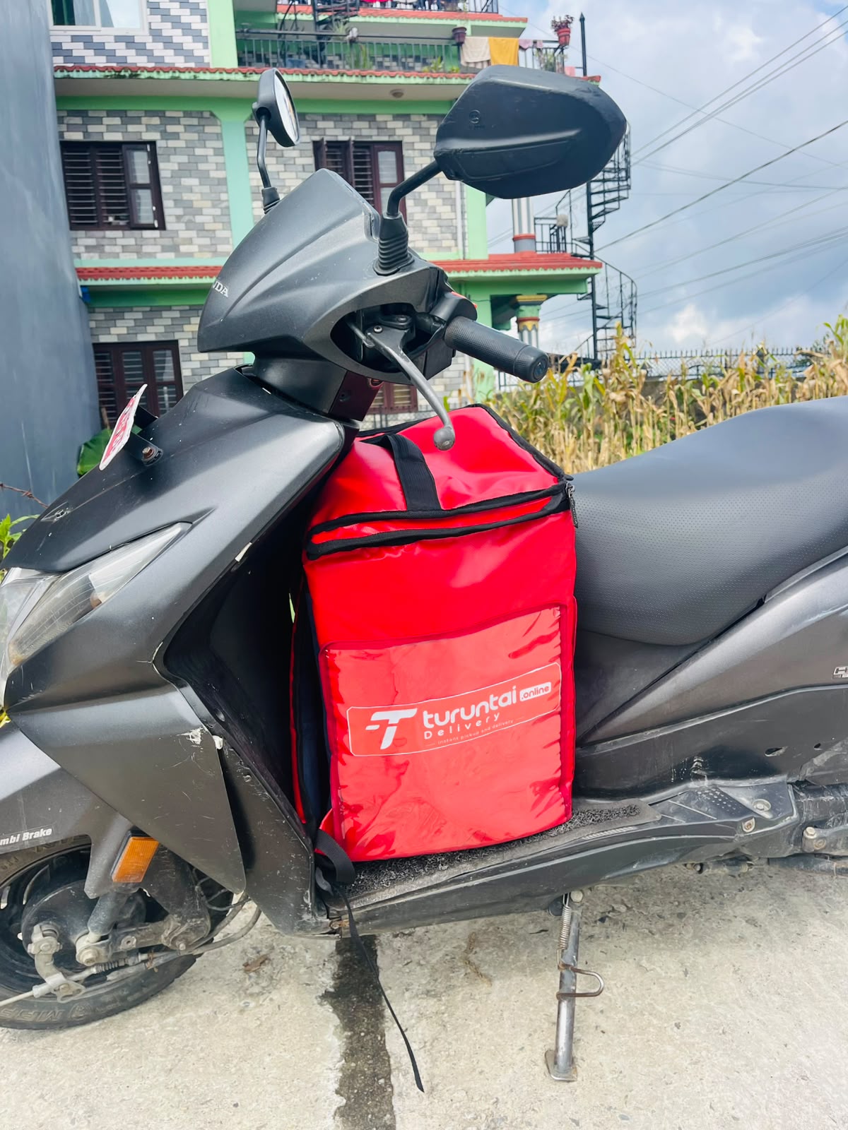 TURUNTAI delivery scooter with branded delivery bag in Pokhara